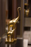Статуэтка Слон золотой с поднятым хоботом