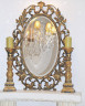 Зеркало овальное в фигурной золотой раме