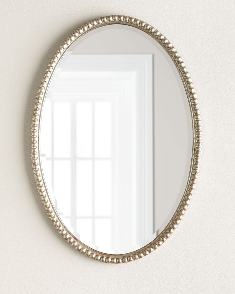 Зеркало овальное в фигурной серебристой раме